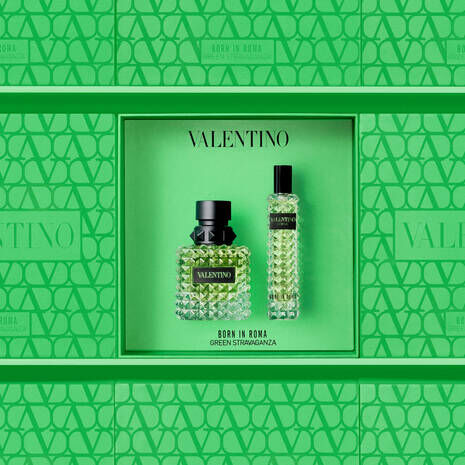 A vibrant green box featuring the Valentino "Born in Roma Green Stravaganza" fragrance, showcasing a textured bottle and a smaller vial, all set against a matching patterned background.